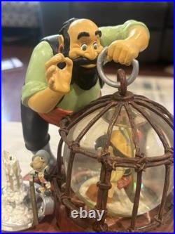 Disney 21103 Pinocchio In Cage Stromboli 8 Snow Globe Jiminy Cricket Toyland Disney 21103 Pinocchio In Cage Stromboli 8 Snow Globe Jiminy Cricket Toyland