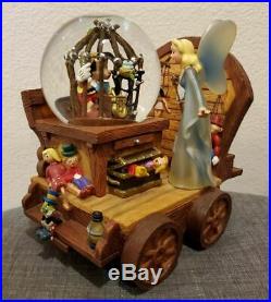 Disney Caged Pinocchio on Stromboli Wagon Cart Musical Snowglobe Blue Fairy Rare