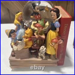 Disney Classics Vol 1 & 11 Through the Years Musical Snow Globe Bookend READ Disney Classics Vol 1 & 11 Through the Years Musical Snow Globe Bookend READ