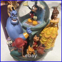 Disney Classics Vol 1 & 11 Through the Years Musical Snow Globe Bookend READ Disney Classics Vol 1 & 11 Through the Years Musical Snow Globe Bookend READ