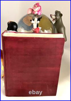 Disney Classics Vol 1 Through the Years Musical Snow Globe Bookend Disney Classics Vol 1 Through the Years Musical Snow Globe Bookend