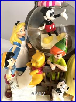 Disney Classics Vol 1 Through the Years Musical Snow Globe Bookend Disney Classics Vol 1 Through the Years Musical Snow Globe Bookend