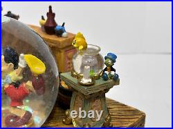 Disney Geppetto's Workshop Pinocchio Snow globe Music Box Working Excellent