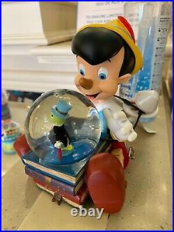 Disneyland Paris Pinocchio Boule à Neige Musicale for sale online