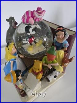 NEW! Disney store many Caracter Snovglobe and Bookend! With music and blower