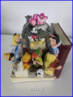 NEW! Disney store many Caracter Snovglobe and Bookend! With music and blower