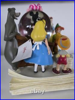 NEW! Disney store many Caracter Snovglobe and Bookend! With music and blower