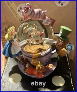 Perfect Condition Disney Parks Alice in Wonderland Tea Cup Spinning Snow Globe