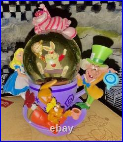 Perfect Condition Disney Parks Alice in Wonderland Tea Cup Spinning Snow Globe