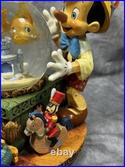 RARE Disney Pinocchio Toyland Fishbowl Musical Snow Globe Cleo Figoro