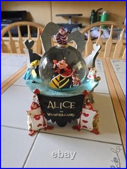 RARE Disney Store Alice in Wonderland Snow Globe nothing broken, music works