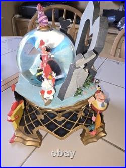 RARE Disney Store Alice in Wonderland Snow Globe nothing broken, music works