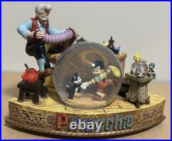 Rare Disney Geppetto's Workshop Pinocchio Snow Globe. Pre owned. (No Box)