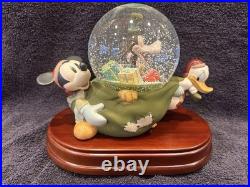 Walt Disney Collectibles Christmas Sack Mickey Donald and Goofy Snow Globe